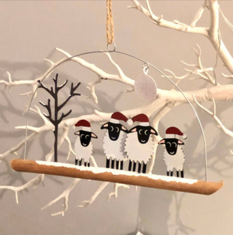 Winter woolly four sheep wearing Christmas hats . Hanging ornament by Sjoeless Joe