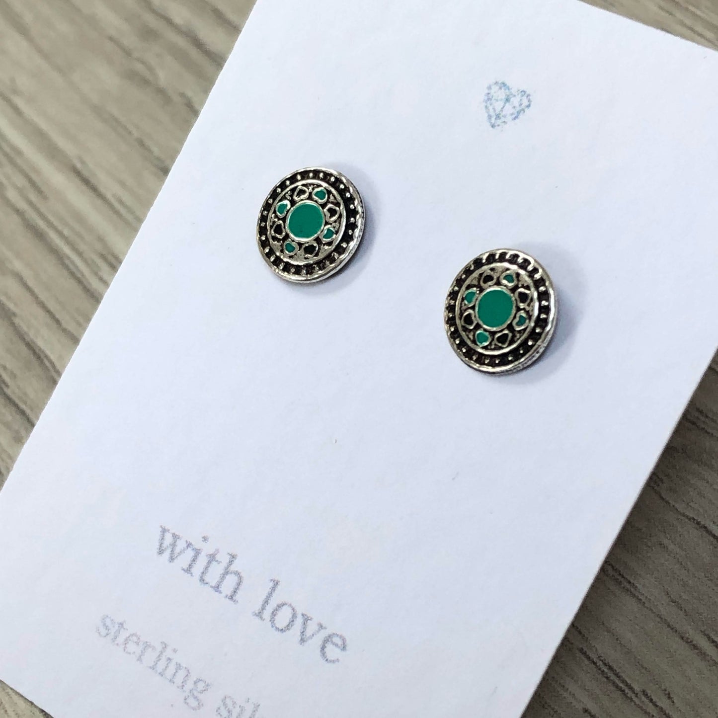 Sterling silver circle stud earrings with enamel detail. Geometric stud designs.