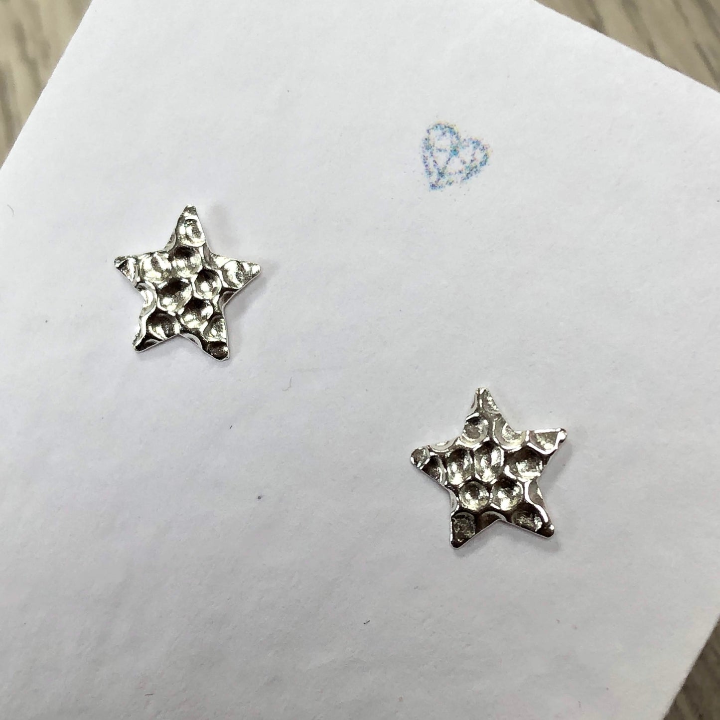 Dimpled textured star stud earrings sterling silver