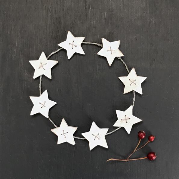 Small white wooden star’s wreath by East of India