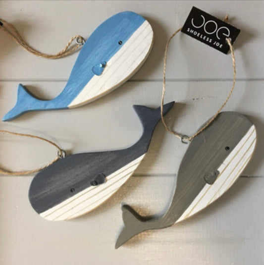 Hanging blue wooden blue whales by Shoeless Joe