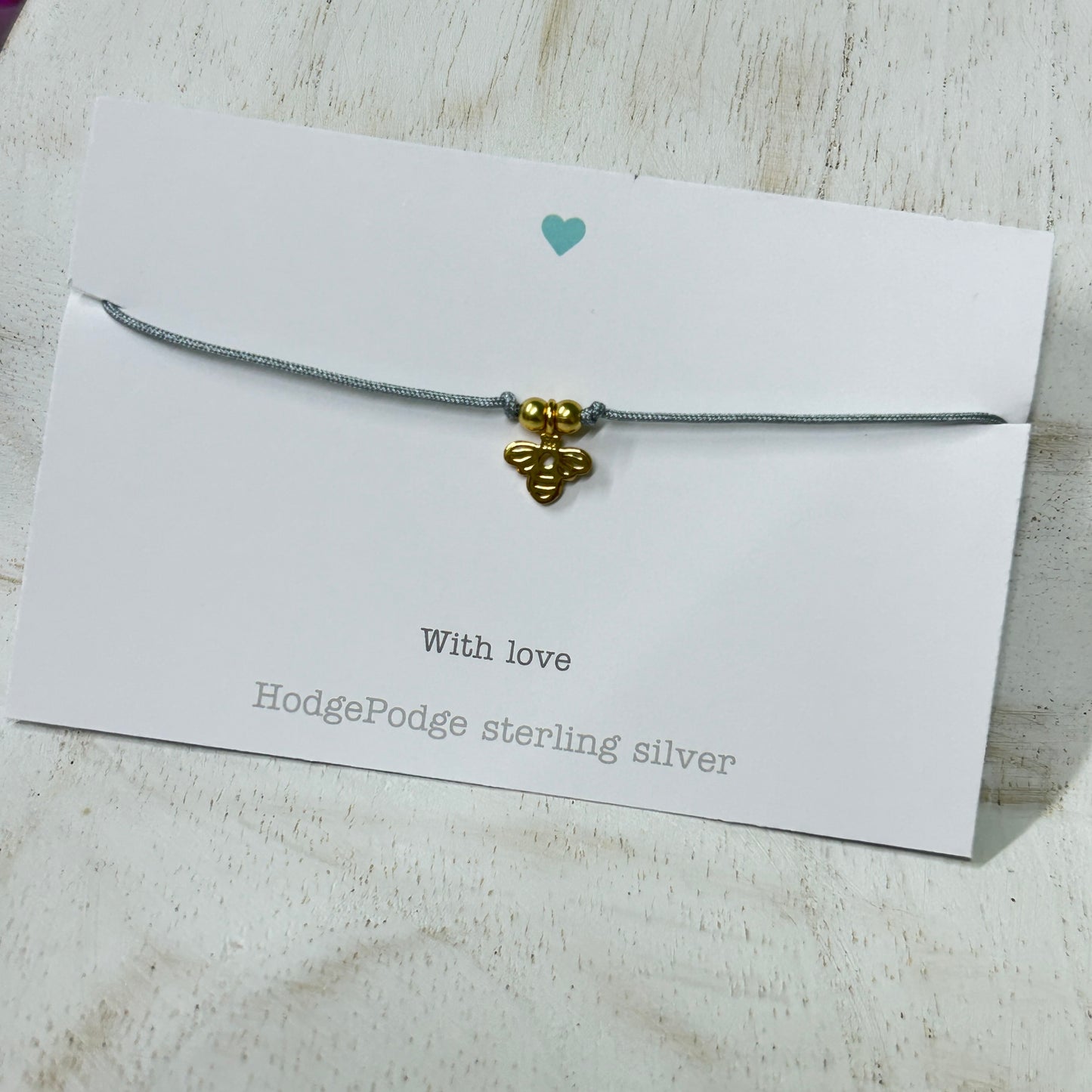 Gold bee charm adjustable cord bracelet