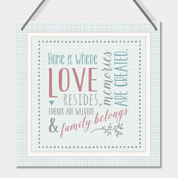 Hanging sign by east of India -home is where love resides
