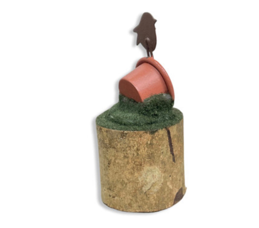 Robins nesting in a plant pot standing ornament by Shoeless Joe