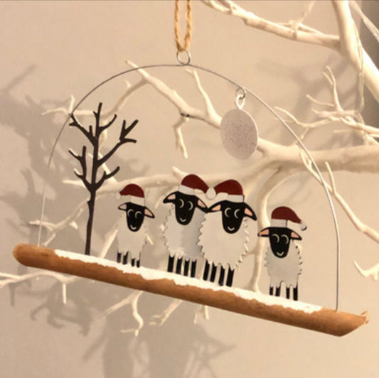 Winter woolly four sheep wearing Christmas hats . Hanging ornament by Sjoeless Joe