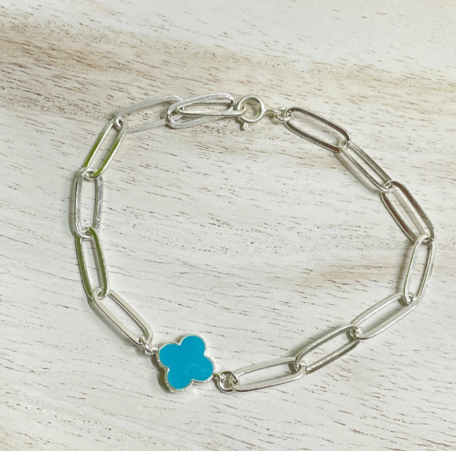 Silver Paperclip chain bracelet with blue clover link charm