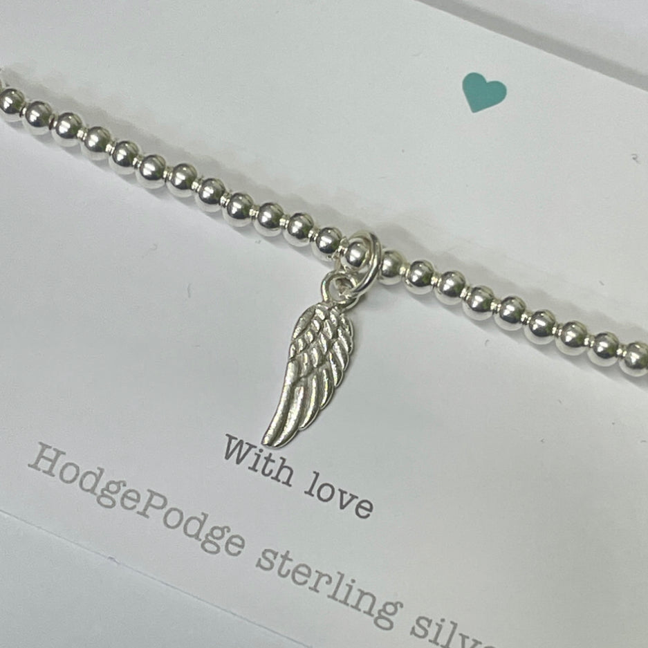 Sterling silver beaded bracelet with angel wing charm