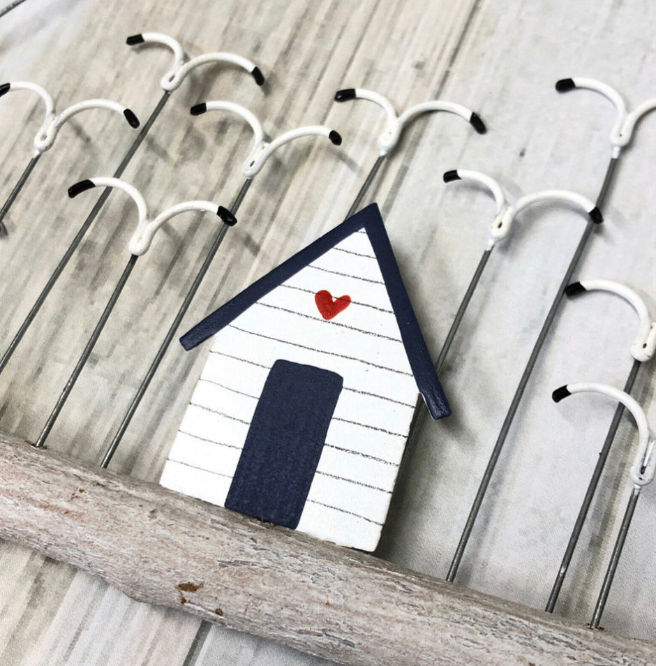 Beach hut with a flock of seagulls on driftwood hanging decoration by Shoeless Joe