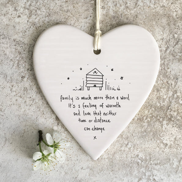 Family is much more than a word .... ceramic hanging heart by east of India