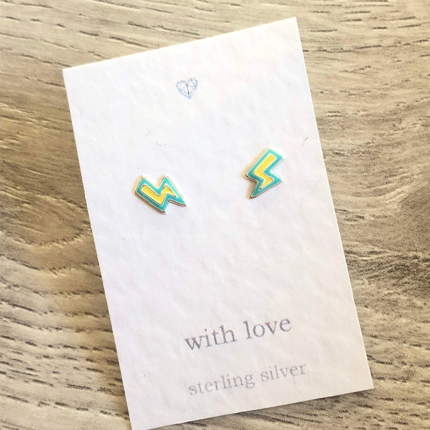 Enamel lightening strike stud earrings in sterling silver.