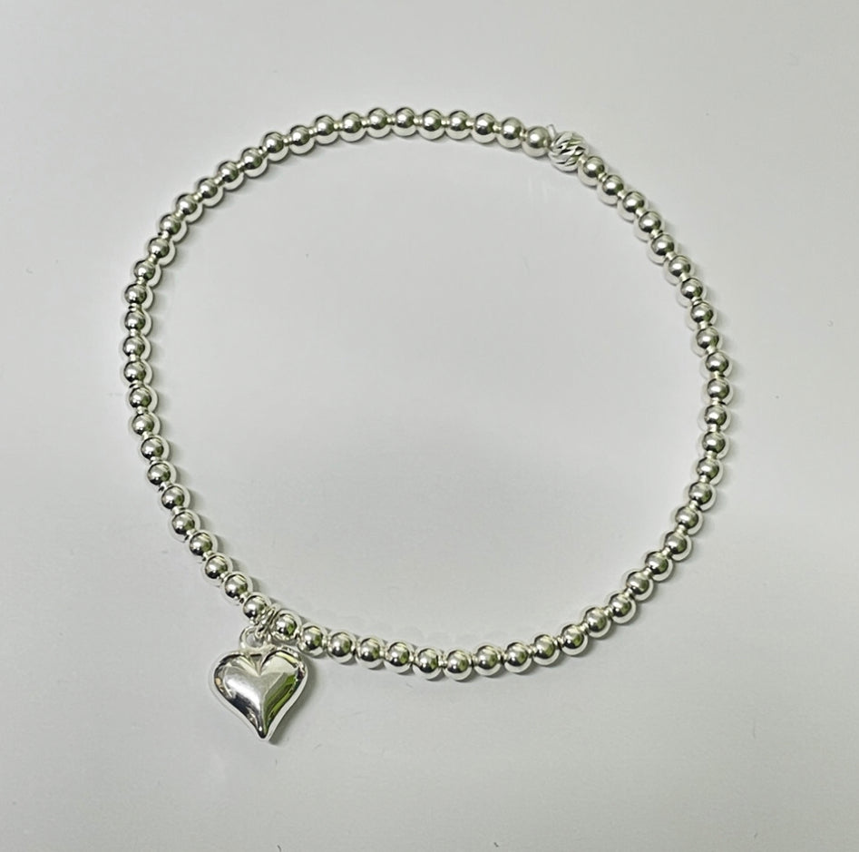 Sterling silver bead bracelet with heart charm