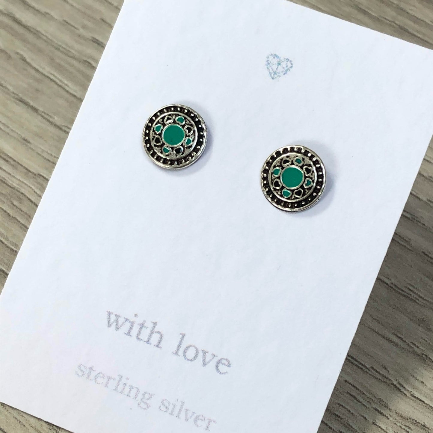Sterling silver circle stud earrings with enamel detail. Geometric stud designs.