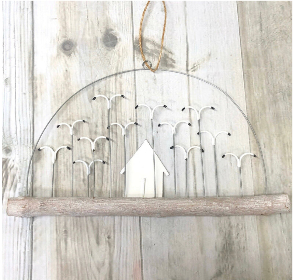 Beach hut with a flock of seagulls on driftwood hanging decoration by Shoeless Joe
