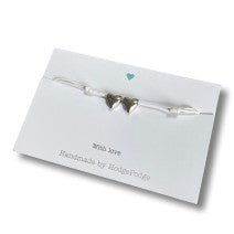 Adjustable cord bracelet heart beads