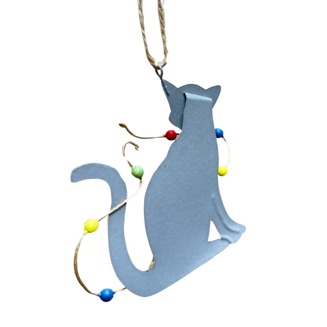 Grey tabby cat with Christmas decoration