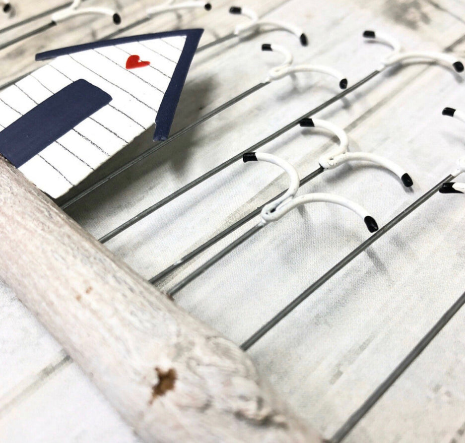 Beach hut with a flock of seagulls on driftwood hanging decoration by Shoeless Joe
