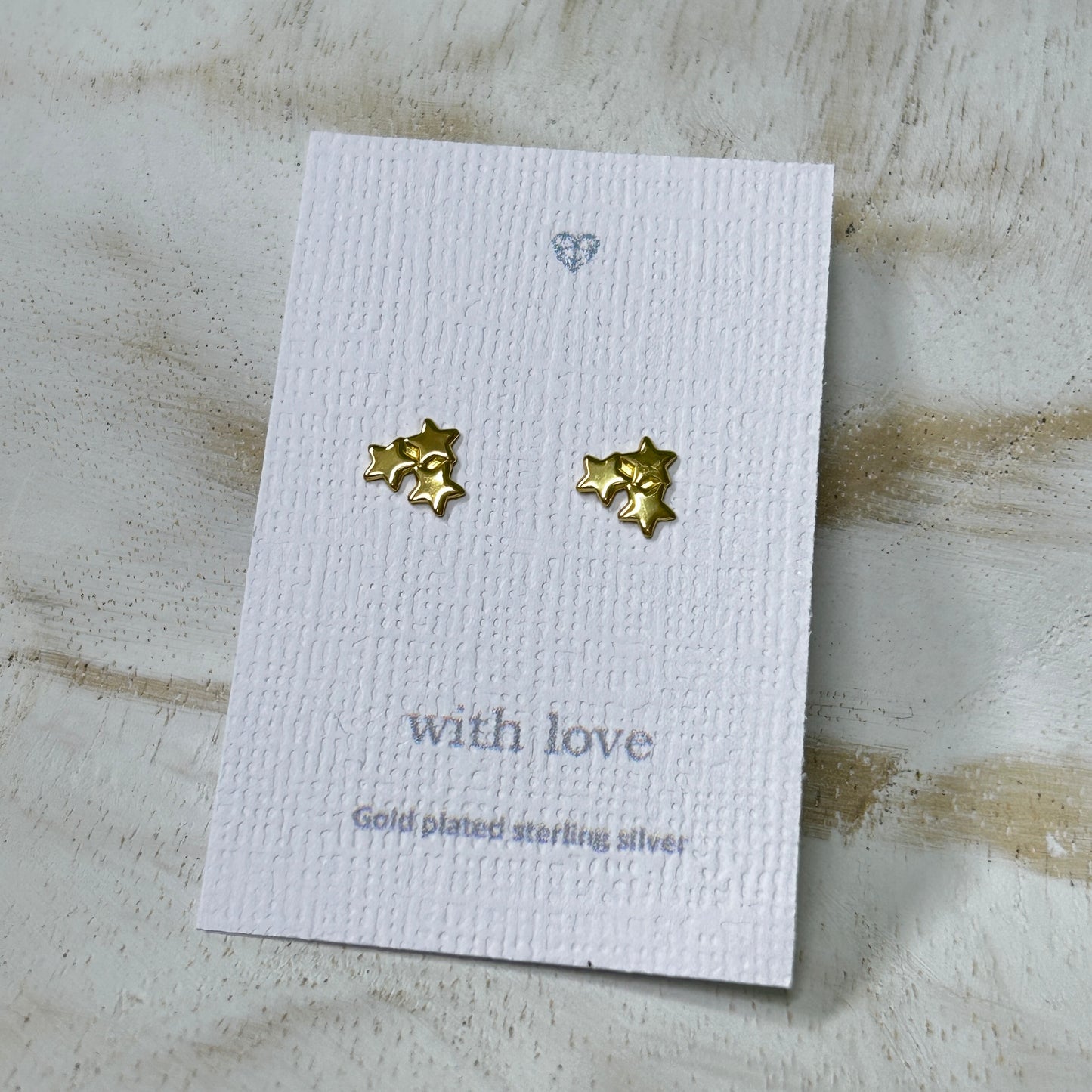 Triple gold star stud earrings