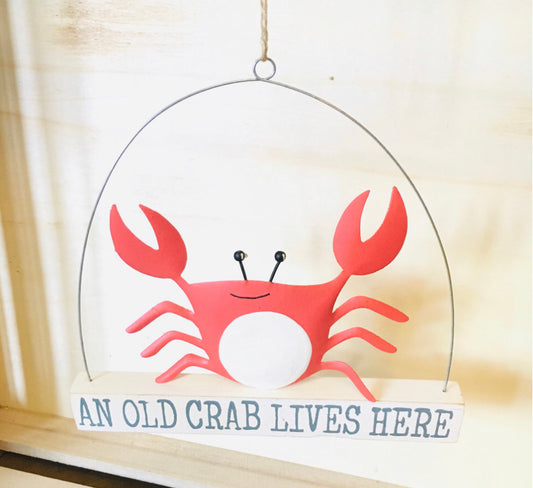 An old crab lives here sign by Shoeless Joe