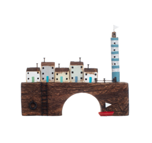 Lighthouse on bridge with a row of costal cottages wooden ornament by Shoeless Joe