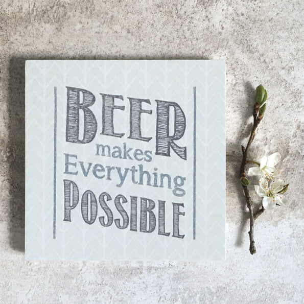 Square coaster- beer makes everything possible by East of India. Dr
