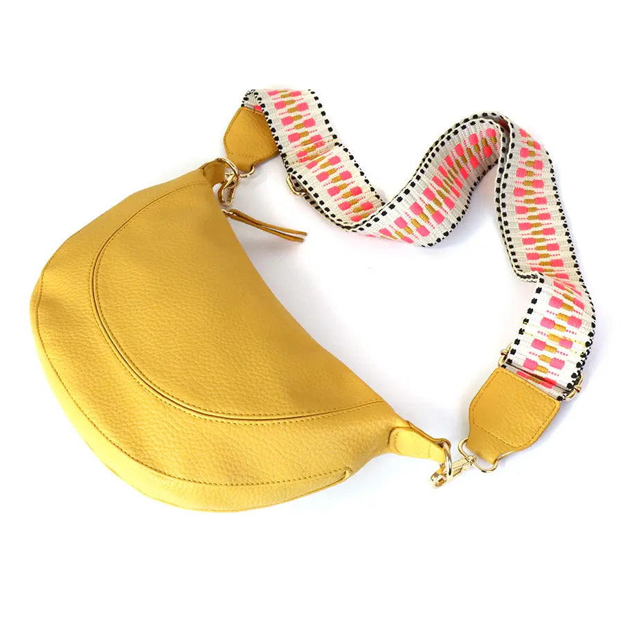 Yellow vegan leather half moon bag with zig-zag strap