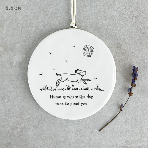 Home is where the dog runs to greet you.  Hanging sign by east of india