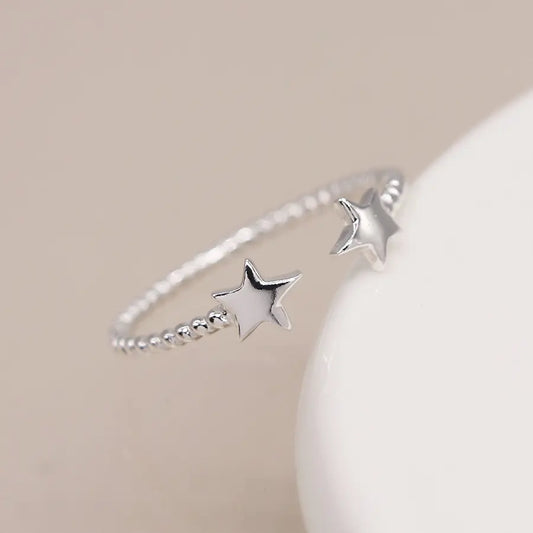 Sterling silver twist and stars ring