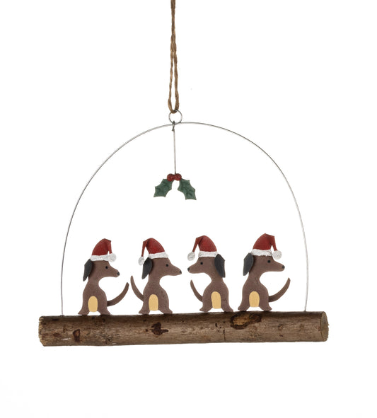 Four festive sausage dogs. Christmas decoration