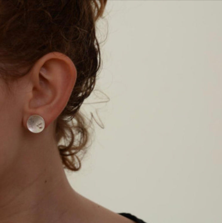 Trio of seeds concave studs by Carmen Palop Design