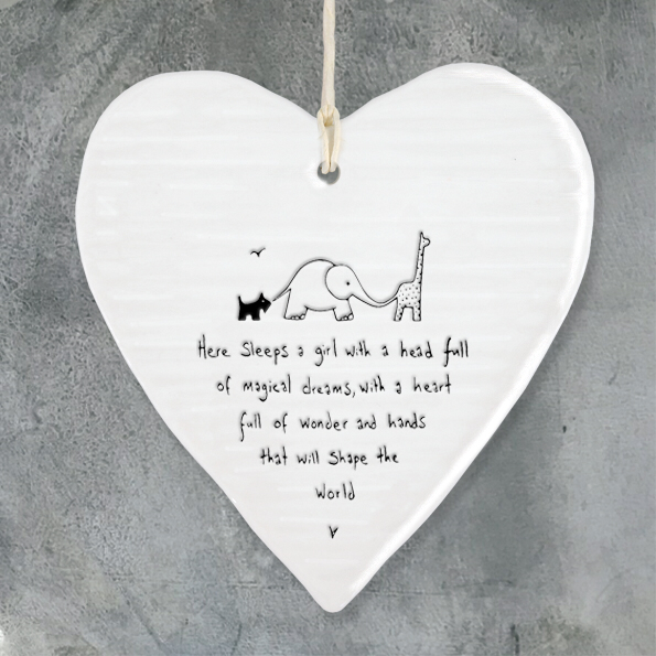 Here sleeps  a girl with a head full of magical dreams , with a heart full of wonderland hands that will shape the world. Hanging porcelain heart by East of India