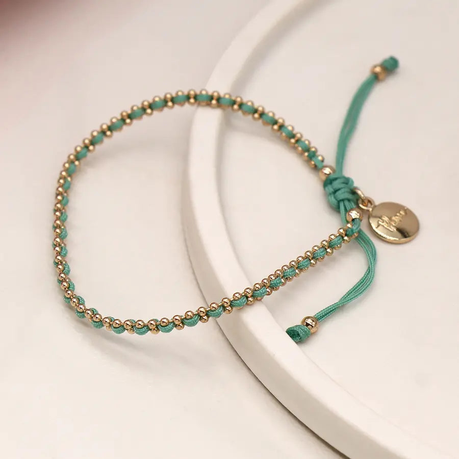 Faux gold bead chain and aqua cord bracelet