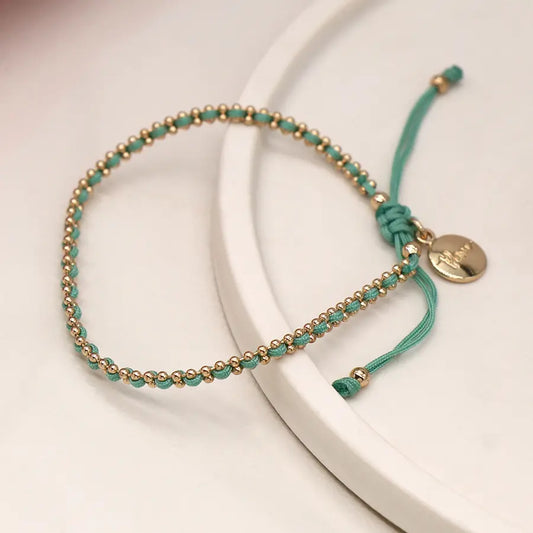 Faux gold bead chain and aqua cord bracelet