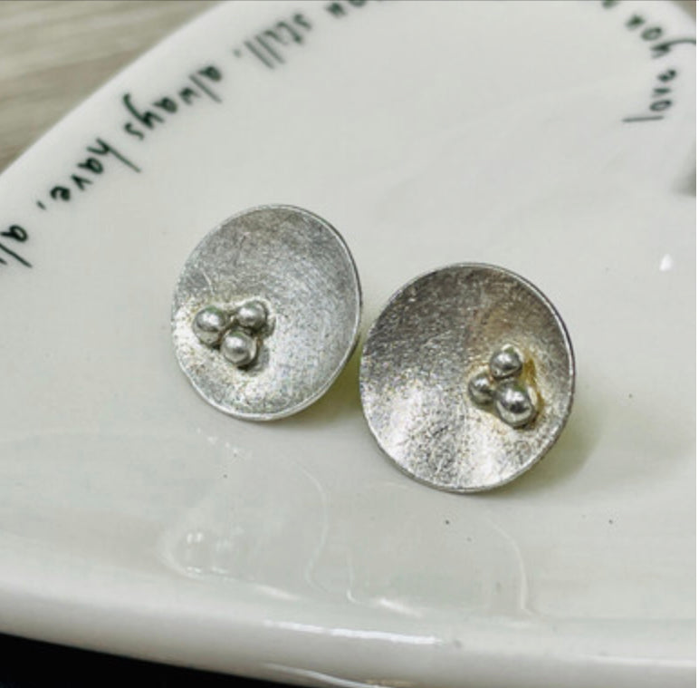 Trio of seeds concave studs by Carmen Palop Design