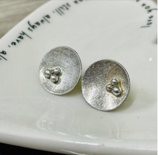 Trio of seeds concave studs by Carmen Palop Design