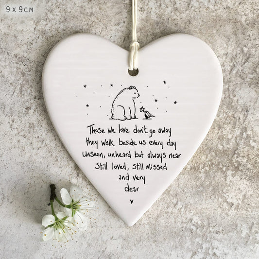 Those we love don’t go away they walk beside us everyday.  ceramic hanging heart decoration.
