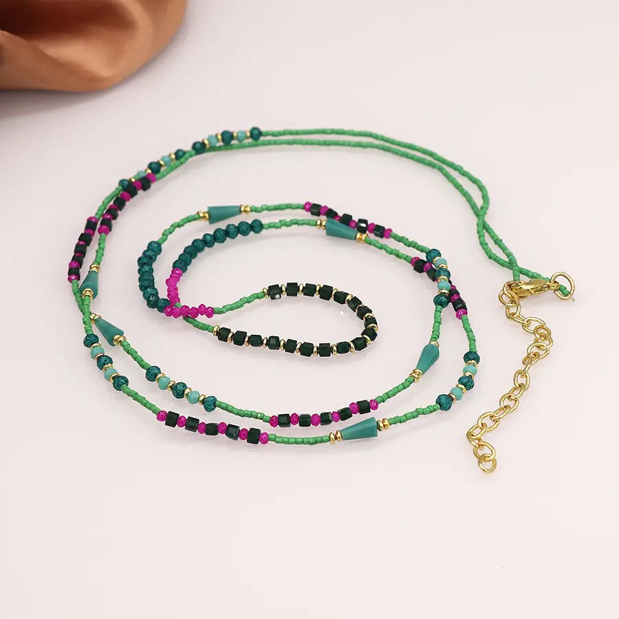 Long boho bead necklace in cerise green and gold