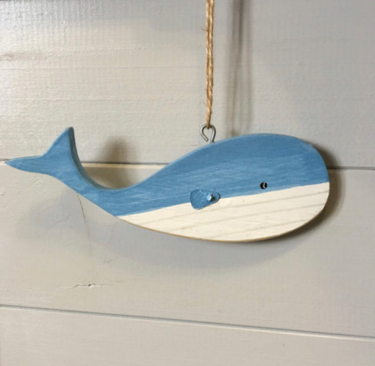 Hanging blue wooden blue whales by Shoeless Joe
