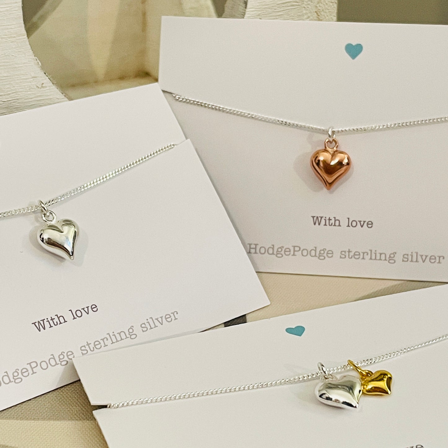Sterling silver puff heart necklace.