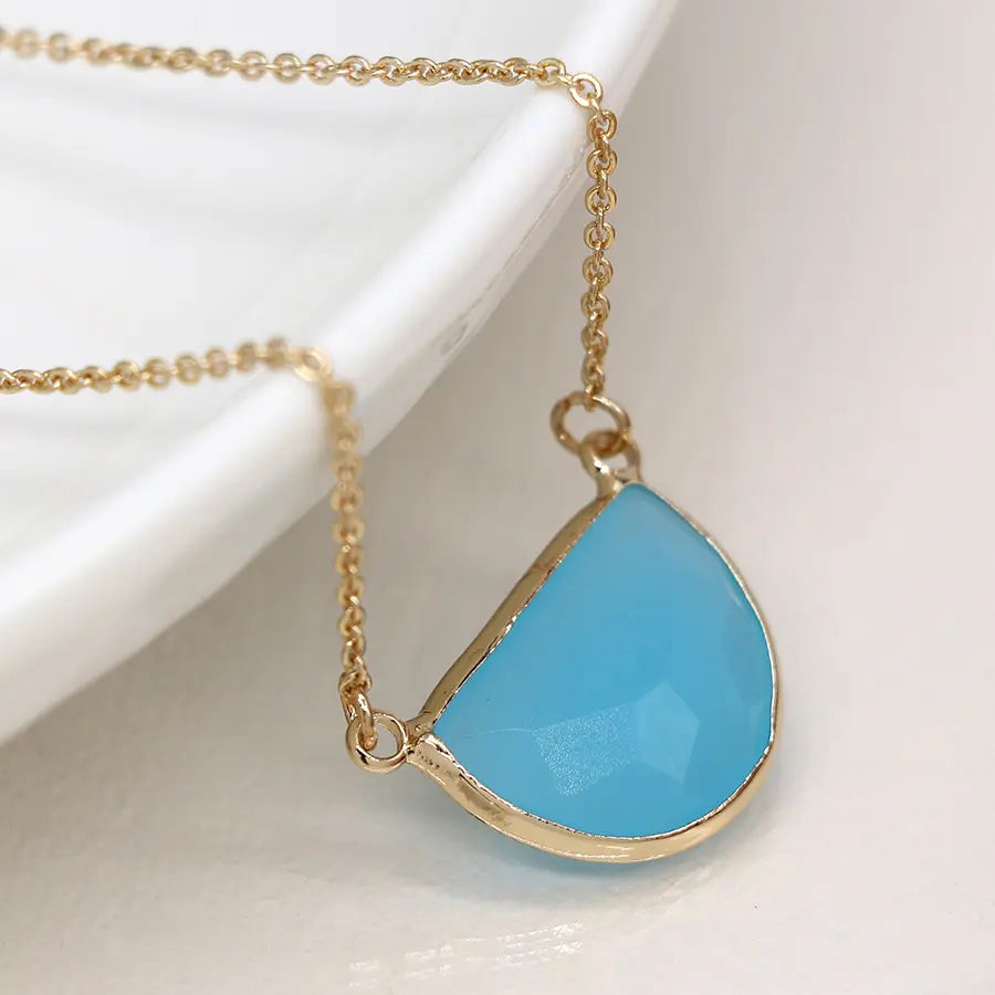 Golden and blue crystal half moon necklace