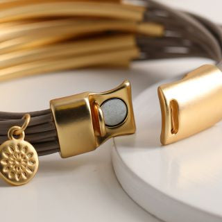 Taupe multi strand and golden bars bracelet by POM