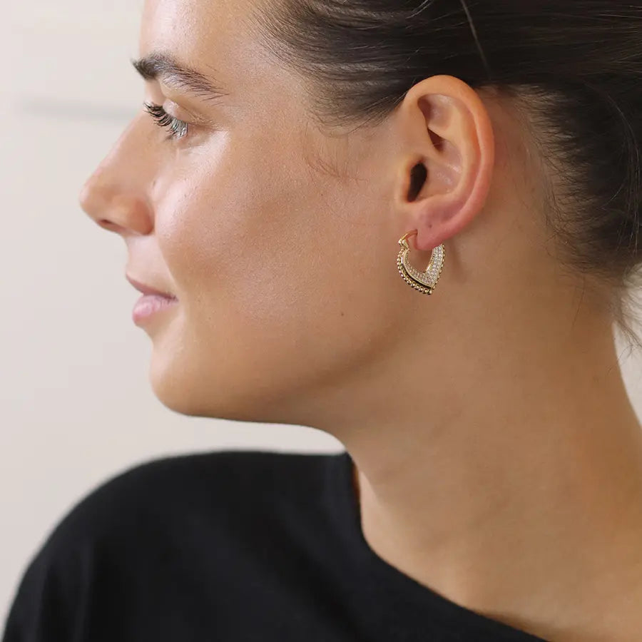 Faux gold v-point hoop earrings with multi crystal inset and decorative edge