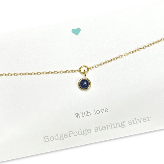 Gold bracelet with sodalite.