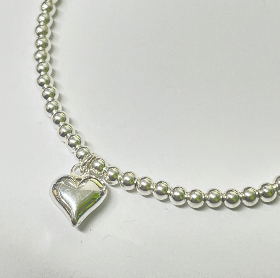 Sterling silver bead bracelet with heart charm