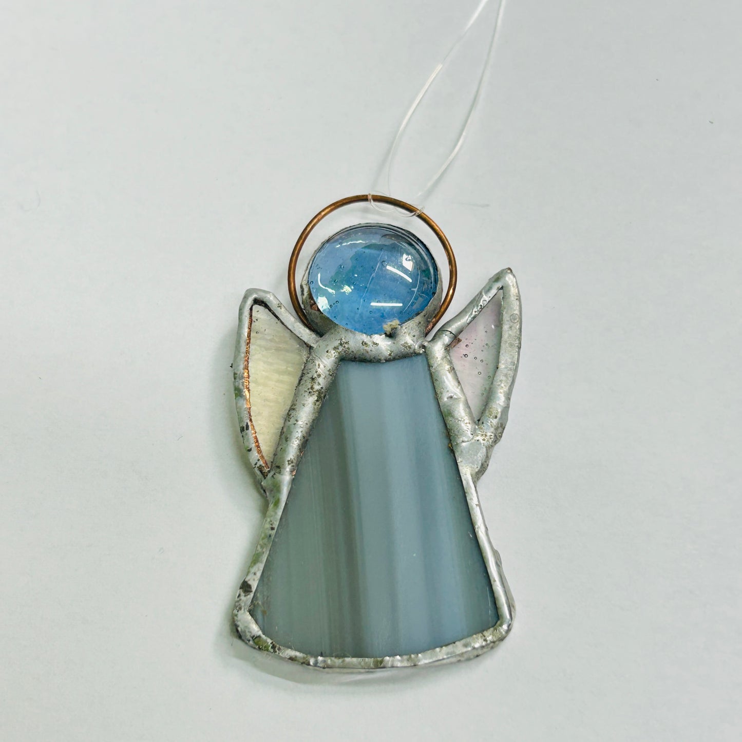 Perc's stained glass guardian angel in grey. Hanging angel decoration hand made in Norfolk.