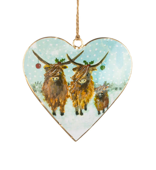 Highland cow trio on a metal heart hanging decoration