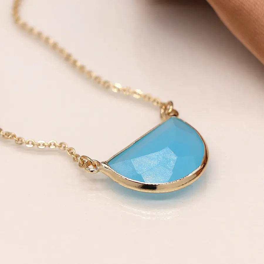 Golden and blue crystal half moon necklace