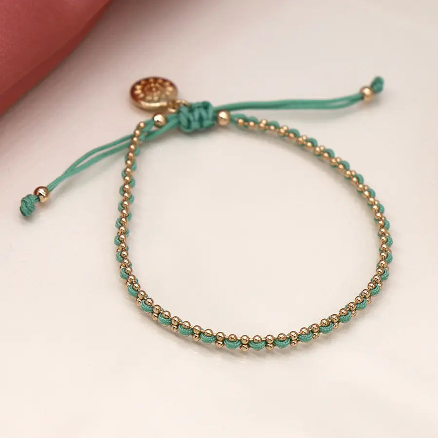 Faux gold bead chain and aqua cord bracelet